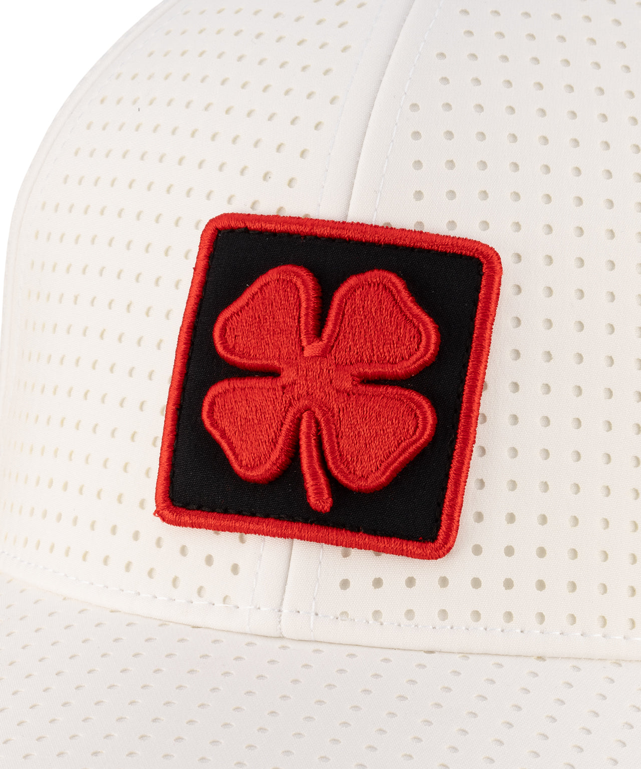 White perforated hat from Black Clover featuring UNLV Logo