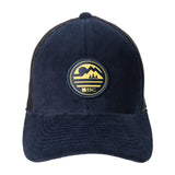 blue corduroy hat with a patch depicting a mountain ridgeline