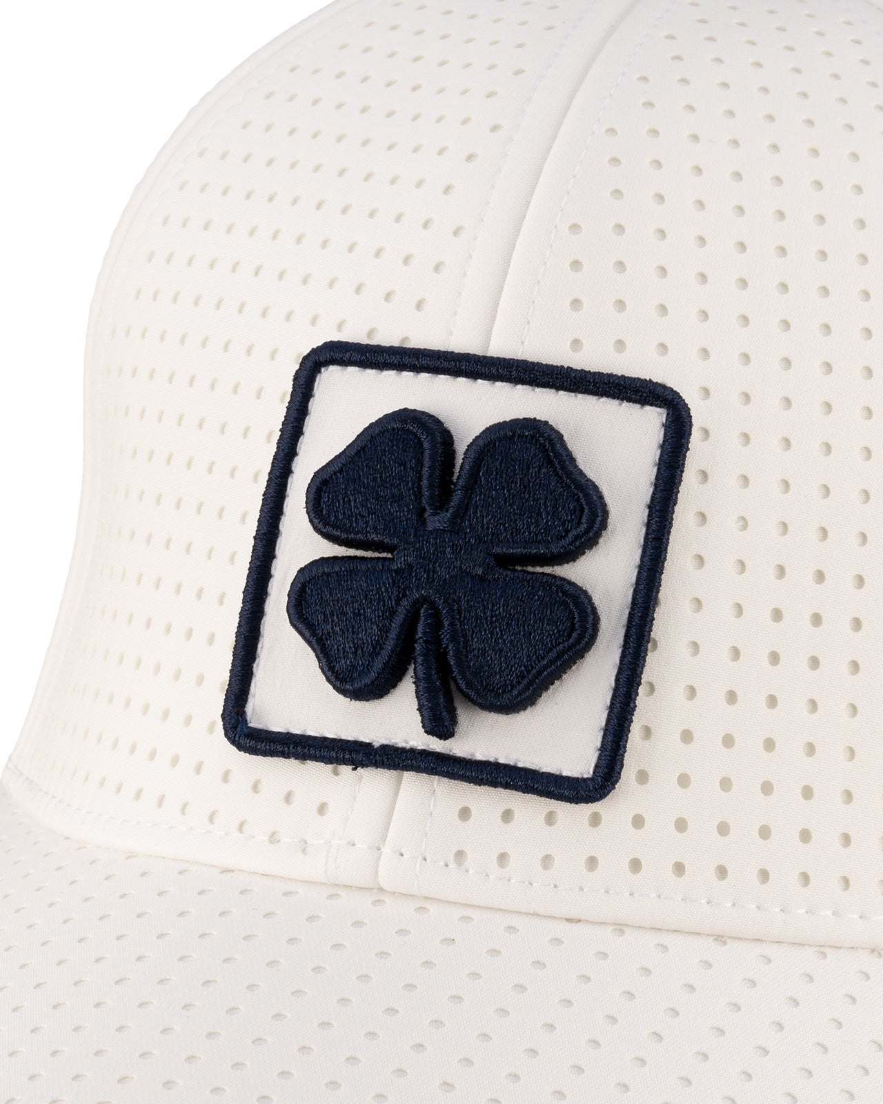 White perforated hat from Black Clover featuring USU Aggies logo