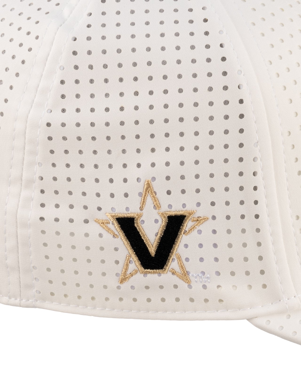 White perforated hat from Black Clover featuring Vanderbilt Commodores logo