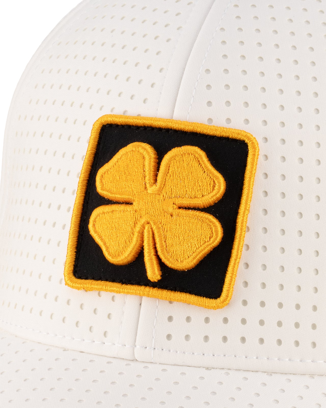 White perforated hat from Black Clover featuring Wichita State Shockers logo